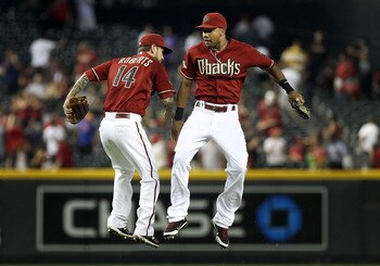 PHOENIX, AZ - AUGUST 10:  Chris Young #24 (R) and Ryan Roberts #14 of the Arizona Diamondbacks celebrate after defeating the Houston Astros in the Major League Baseball game at Chase Field on August 10, 2011 in Phoenix, Arizona. The Diamondbacks defeated