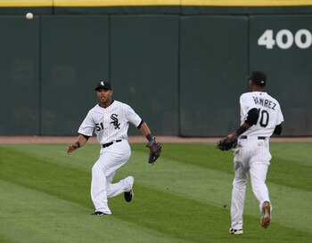 CHICAGO, IL - AUGUST 03: Alex Rios #51 of the Chicago White Sox misplays a fly ball in center field as teammate Alexei Ramirez #10 runs out against the New York Yankees at U.S. Cellular Field on August 3, 2011 in Chicago, Illinois. (Photo by Jonathan Dani