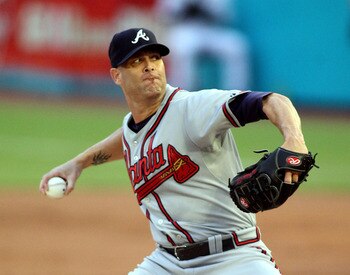 MIAMI GARDENS, FL - AUGUST 10:  Pitcher Tim Hudson #15 of the Atlanta Braves throws against the Florida Marlins at Sun Life Stadium on August 10, 2011 in Miami Gardens, Florida.  (Photo by Marc Serota/Getty Images)