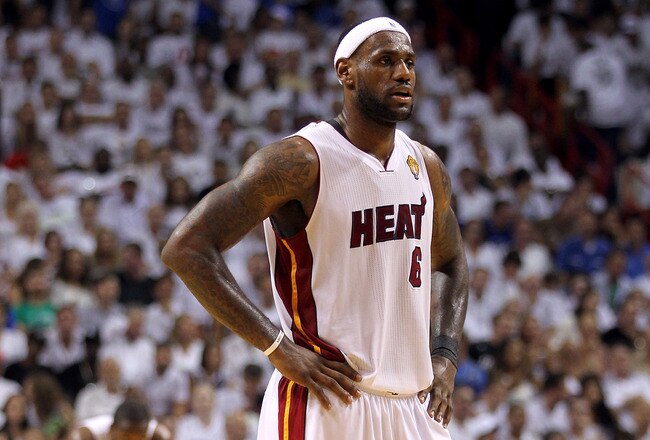 MIAMI, FL - JUNE 12:  LeBron James #6 of the Miami Heat looks on as Dwyane Wade stands in the background against the Dallas Mavericks in Game Six of the 2011 NBA Finals at American Airlines Arena on June 12, 2011 in Miami, Florida. NOTE TO USER: User expr