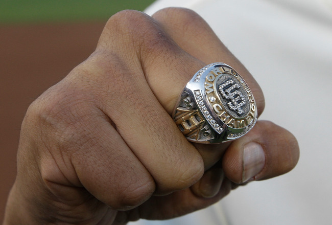 SAN FRANCISCO, CA - APRIL 09:  A member of the San Francisco Giants holds up his World Series ring before the start of the game against the St. Louis Cardinals at AT&T Park on April 9, 2011 in San Francisco, California.  (Photo by Eric Risberg-Pool/Getty