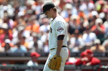 SAN FRANCISCO, CA - AUGUST 06:  Matt Cain #18 of the San Francisco Giants looks on after allowing two runs in the first inning against the Philadelphia Phillies at AT&T Park on August 6, 2011 in San Francisco, California.  (Photo by Jed Jacobsohn/Getty Im