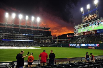 CLEVELAND, OH - AUGUST 9: Fans enjoy the sun sets over Progressive Field during a rain delay in the second inning of the game between the Cleveland Indians and the Detroit Tigers on August 9, 2011 in Cleveland, Ohio. (Photo by Jason Miller/Getty Images)