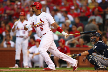 ST. LOUIS, MO - AUGUST 11: Albert Pujols #5 of the St. Louis Cardinals hits a solo home run against the Milwaukee Brewers at Busch Stadium on August 11, 2011 in St. Louis, Missouri.  (Photo by Dilip Vishwanat/Getty Images)