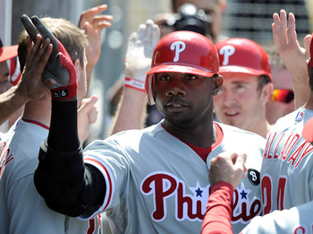 LOS ANGELES, CA - AUGUST 10:  Ryan Howard #6 of the Philadelphia Phillies celebrates with the dugout after a two run homerun to take a 9-7 lead over the Los Angeles Dodgers during the seventh inning at Dodger Stadium on August 10, 2011 in Los Angeles, Cal