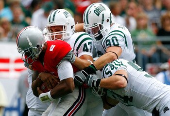 COLUMBUS, OH - SEPTEMBER 06:  Backup quarterback Terrelle Pryor #2 of the Ohio State Buckeyes is tackled by defenders Noah Keller #47, Kris Luchsinger #54 and Jameson Hartke #90 of the Ohio Bobcats during the game at Ohio Stadium on September 6, 2008 in C