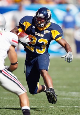 CLEVELAND - SEPTEMBER 19: Morgan Williams #23 of the Toledo Rockets carries the ball during the game against the Ohio State Buckeyes  at Cleveland Browns Stadium on September 19, 2009 in Cleveland, Ohio. The Ohio State Buckeyes shutout the Toledo Rockets