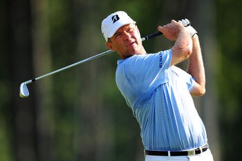 JOHNS CREEK, GA - AUGUST 12:  Davis Love III hits a shot during the second round of the 93rd PGA Championship at the Atlanta Athletic Club on August 12, 2011 in Johns Creek, Georgia.  (Photo by Stuart Franklin/Getty Images)