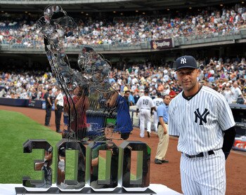 NEW YORK, NY - AUGUST 13: Derek Jeter #2 of the New York Yankees poses with a sculpture during a ceremony honoring him for his 3000th career hit prior to the game against the Tampa Bay Rays at Yankee Stadium on August 13, 2011 in the Bronx borough of New
