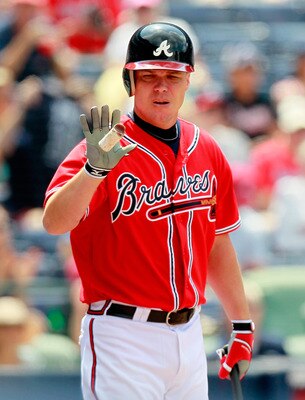 ATLANTA, GA - JULY 31:  Chipper Jones #10 of the Atlanta Braves catches some pine tar for his bat against the Florida Marlins at Turner Field on July 31, 2011 in Atlanta, Georgia.  (Photo by Kevin C. Cox/Getty Images)