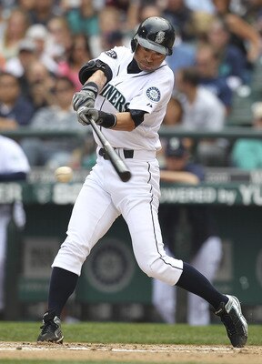 SEATTLE - AUGUST 14:  Ichiro Suzuki #51 of the Seattle Mariners singles in the fifth inning against the Boston Red Sox at Safeco Field on August 14, 2011 in Seattle, Washington. (Photo by Otto Greule Jr/Getty Images)