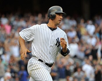 NEW YORK, NY - AUGUST 13: Jorge Posada #20 of the New York Yankees watches his grand slam as he runs up the first base line in the bottom of the fifth inning against the Tampa Bay Rays at Yankee Stadium on August 13, 2011 in the Bronx borough of New York