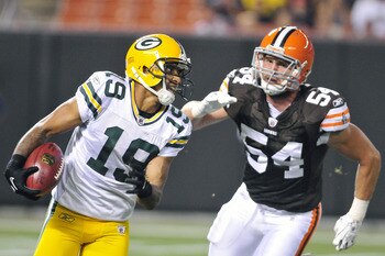CLEVELAND, OH - AUGUST 13: Ben Jacobs #54 of the Cleveland Browns pursues Diondre Borel #19 of the Green Bay Packers during the third quarter at Cleveland Browns Stadium on August 13, 2011 in Cleveland, Ohio. The Browns defeated the Packers 27-17. (Photo