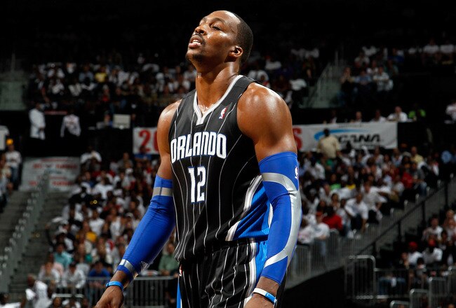 ATLANTA, GA - APRIL 28:  Dwight Howard #12 of the Orlando Magic walks to the bench after a turnover to the Atlanta Hawks during Game Six of the Eastern Conference Quarterfinals in the 2011 NBA Playoffs at Philips Arena on April 28, 2011 in Atlanta, Georgi