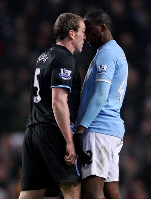 MANCHESTER, ENGLAND - MARCH 02:  Richard Dunne of Aston Villa clashes with Yaya Toure of Manchester City during the FA Cup sponsored by E.On Fifth Round match between Manchester City and Aston Villa at the City of Manchester Stadium on March 2, 2011 in Ma