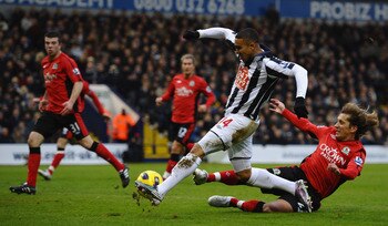 WEST BROMWICH, ENGLAND - DECEMBER 28:  Jerome Thomas of West Bromwich Albion scores the equalising goal under pressure from Michel Salgado of Blackburn Rovers  during the Barclays Premier League match between West Bromwich Albion and Blackburn Rovers at T
