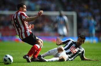 SUNDERLAND, ENGLAND - APRIL 09: Paul Scharner of West Bromwich Albion battles with Steed Makbranque of Sunderland during the Barclays Premier League match between Sunderland and West Bromwich Albion at The Stadium of Light on April 9, 2011 in Sunderland,