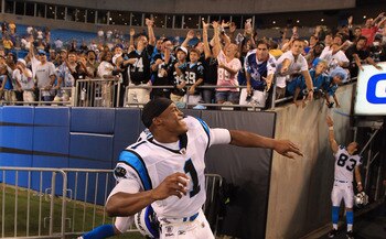 CHARLOTTE, NC - AUGUST 13:  Cam  Newton #1 of the Carolina Panthers throws his arm bands into the crowd after defeating the New York Giants 20-10 at Bank of America Stadium on August 13, 2011 in Charlotte, North Carolina.  (Photo by Streeter Lecka/Getty I