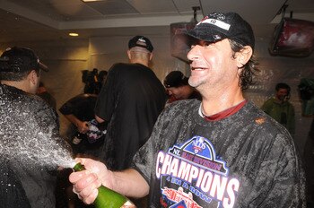 WASHINGTON - SEPTEMBER 27:  Jamie Moyer of the Philadelphia Phillies celebrates clinching the National League EasT title after a baseball game against the Washington Nationals on September 27, 2010 at Nationals Park in Washington, D.C.  The Phillies won 8