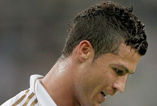 TIANJIN, CHINA - AUGUST 06:  Cristiano Ronaldo of Real Madrid celebrates scoring a goal during the pre-season friendly match between Tianjin Teda and Real Madrid at Water Drop Stadium on August 6, 2011 in Tianjin, China. (Photo by Lintao Zhang/Getty Image
