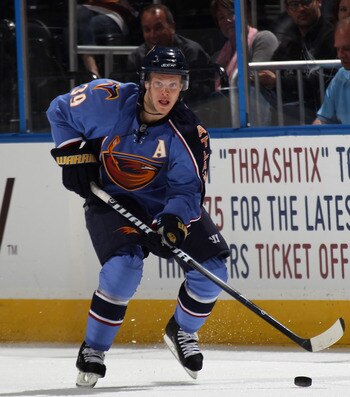 ATLANTA, GA - MARCH 27:  Tobias Enstrom #39 of the Atlanta Thrashers skates against the Atlanta Thrashers at the Philips Arena on March 27, 2011 in Atlanta, Georgia. The Thrashers defeated the 5-4 in the shoot out.  (Photo by Bruce Bennett/Getty Images)