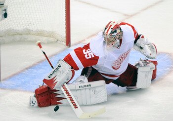 SAN JOSE, CA - MAY 12: Goalie Jimmy Howard #35 the Detroit Red Wings makes a save in the second period in Game Seven of the Western Conference Semifinals  during the 2011 NHL Stanley Cup Playoffs at the HP Pavilion on May 12, 2011 in San Jose, California.