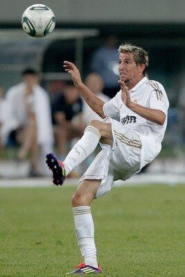 TIANJIN, CHINA - AUGUST 06:  Fabio Coentrao of Real Madrid controls the ball during the pre-season friendly match between Tianjin Teda and Real Madrid at Water Drop Stadium on August 6, 2011 in Tianjin, China.  (Photo by Lintao Zhang/Getty Images)