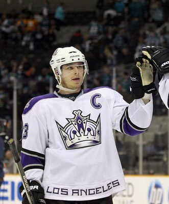 SAN JOSE, CA - APRIL 23:  Dustin Brown #23 and Justin Williams #14 of the Los Angeles Kings celebrate after they beat the San Jose Sharks in game five of the Western Conference Quarterfinals during the 2011 NHL Stanley Cup Playoffs at HP Pavilion on April