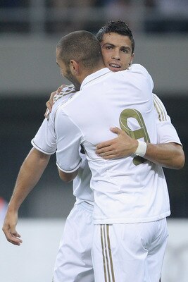 TIANJIN, CHINA - AUGUST 06:  Karim Benzema celebrates a goal with Cristiano Ronaldo of Real Madrid during the pre-season friendly match between Tianjin Teda and Real Madrid at Water Drop Stadium on August 6, 2011 in Tianjin, China.  (Photo by Feng Li/Gett