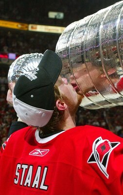RALEIGH, NC - JUNE 19:  Eric Staal #12 of the Carolina Hurricanes kisses the Stanley Cup after defeating the Edmonton Oilers in game seven of the 2006 NHL Stanley Cup Finals on June 19, 2006 at the RBC Center in Raleigh, North Carolina. The Hurricanes def
