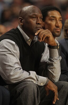 CHICAGO, IL - FEBRUARY 15: Former players Michael Jordan and Scottie Pippen of the Chicago Bulls watch as the Bulls take on the Charlotte Bobcats at the United Center on February 15, 2011 in Chicago, Illinois. NOTE TO USER: User expressly acknowledges and