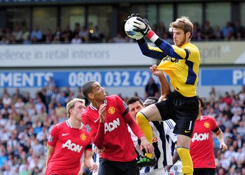 WEST BROMWICH, ENGLAND - AUGUST 14: Goalkeeper David De Gea of Manchester United claims a cross during the Barclays Premier League match between West Bromwich Albion and Manchester United at The Hawthorns on August 14, 2011 in West Bromwich, England.  (Ph