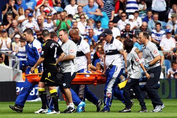 LONDON, ENGLAND - AUGUST 13:  Kieron Dyer of Queens Park Rangers is stretchered off during the Barclays Premier League match between Queens Park Rangers and Bolton Wanderers at Loftus Road on August 13, 2011 in London, England.  (Photo by Michael Steele/G