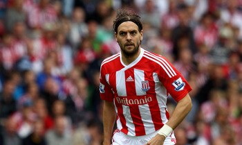 STOKE ON TRENT, ENGLAND - AUGUST 14:  Jonathan Woodgate of Stoke controls the ball during the Barclays Premier League match between Stoke City and Chelsea at the Britannia Stadium on August 14, 2011 in Stoke on Trent, England.  (Photo by Clive Brunskill/G