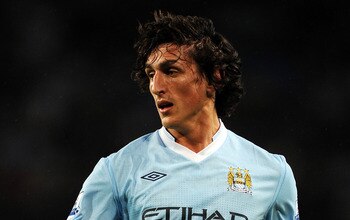 MANCHESTER, ENGLAND - AUGUST 15:  Stefan Savic of Manchester City in action during the Barclays Premier League match between Manchester City and Swansea City at Etihad Stadium on August 15, 2011 in Manchester, England.  (Photo by Chris Brunskill/Getty Ima