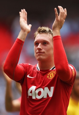 LONDON, ENGLAND - AUGUST 07:  Phil Jones of Manchester United applauds fans after victory in the FA Community Shield match sponsored by McDonald's between Manchester City and Manchester United at Wembley Stadium on August 7, 2011 in London, England.  (Pho