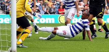 LONDON, ENGLAND - AUGUST 13:  Danny Gabbidon (C) of Queens Park Rangers scores an own goal during the Barclays Premier League match between Queens Park Rangers and Bolton Wanderers at Loftus Road on August 13, 2011 in London, England.  (Photo by Michael S