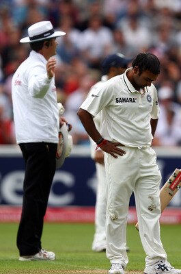 BIRMINGHAM, ENGLAND - AUGUST 12:  Amit Mishra of India looks down at his footing after bowling during day three of the 3rd npower Test at Edgbaston on August 12, 2011 in Birmingham, England.  (Photo by Richard Heathcote/Getty Images)