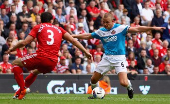 New Liverpool signing Jose Enrique does battle with Sunderland's Lee Cattermole