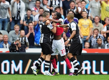New Arsenal signing Gervinho, center, was shown a red card following an alteraction with Newcastle midfielder Joey Barton, left