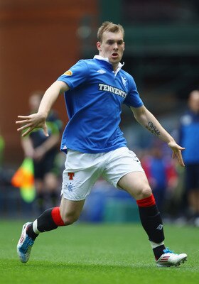 GLASGOW, SCOTLAND - MAY 07:  Gregg Wylde of Rangers in action during the Clydesdale Bank Premier League match between Rangers and Hearts at Ibrox Stadium salutes his supporters on May 7, 2011 in Glasgow, Scotland.  (Photo by Jeff J Mitchell/Getty Images)