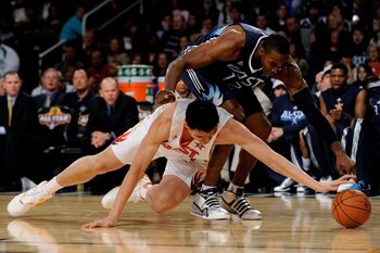 PHOENIX - FEBRUARY 15:  Yao Ming #11 of the Western Conference reaches for a loose ball under pressure from Dwight Howard #12 of the Eastern Conference during the 58th NBA All-Star Game, part of 2009 NBA All-Star Weekend at US Airways Center on February 1
