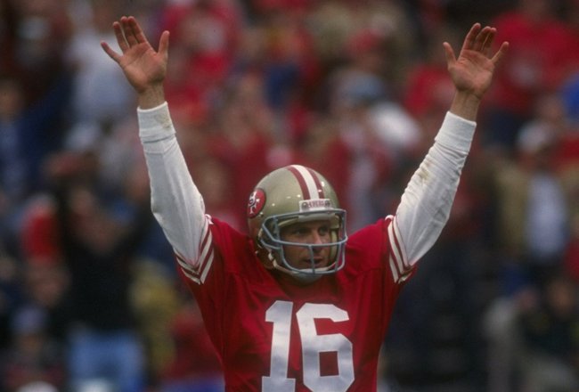 13 Jan 1991:  Quarterback Joe Montana #16 of the San Francisco 49ers raises his hands in celebration as he signals a touch down following a successful reception in the endzone during a play in the 49ers 28-10 victory over the Washington Redskins at Candls