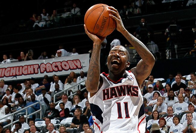 ATLANTA, GA - APRIL 22:  Jamal Crawford #11 of the Atlanta Hawks shoots against J.J. Redick #7 of the Orlando Magic during Game Three of the Eastern Conference Quarterfinals in the 2011 NBA Playoffs at Philips Arena on April 22, 2011 in Atlanta, Georgia.