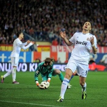 MADRID, SPAIN - MARCH 19: Karim Benzema of Real Madrid reacts after his shot at goal was saved   during the La Liga match between Atletico Madrid and Real Madrid at Vicente Calderon Stadium on March 19, 2011 in Madrid, Spain.  (Photo by Denis Doyle/Getty
