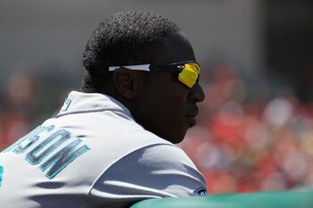 ANAHEIM, CA - AUGUST 07:  Trayvon Robinson #12 of the Seattle Mariners looks on from the dugout as his team bats against the Los Angeles Angels of Anaheim on August 7, 2011 at Angel Stadium in Anaheim, California.  The Angels won 2-1.  (Photo by Stephen D