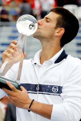 MONTREAL, QC - AUGUST 14:  Novak Djokovic of Serbia kisses his trophy after defeating Mardy Fish of the United States in the final of the Rogers Cup at Uniprix Stadium on August 14, 2011 in Montreal, Quebec, Canada.  (Photo by Matthew Stockman/Getty Image