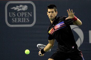 MONTREAL, QC - AUGUST 13: Novak Djokovic of Serbia returns a shot to Jo-Wilfried Tsonga of France during the Rogers Cup at Uniprix Stadium on August 13, 2011 in Montreal, Canada.  (Photo by Matthew Stockman/Getty Images)