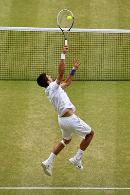 LONDON, ENGLAND - JULY 03:  Novak Djokovic of Serbia returns a shot during his final round Gentlemen's match against Rafael Nadal of Spain on Day Thirteen of the Wimbledon Lawn Tennis Championships at the All England Lawn Tennis and Croquet Club on July 3