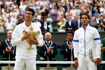 LONDON, ENGLAND - JULY 03:  Winner Novak Djokovic of Serbia (L) and runner-up Rafael Nadal of Spain with their trophies after their final round Gentlemen's match on Day Thirteen of the Wimbledon Lawn Tennis Championships at the All England Lawn Tennis and
